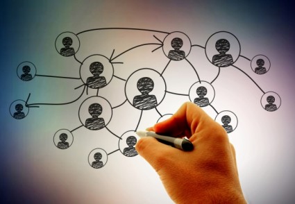 Networking_businessman-hand-drawing-social-network